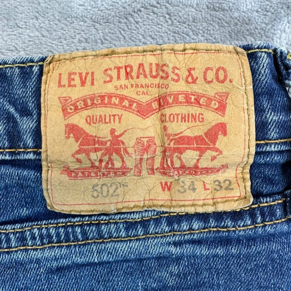 Levi's 502 Taper Fit Jeans Mens Size 34x32 Blue Medium Wash Denim Pants